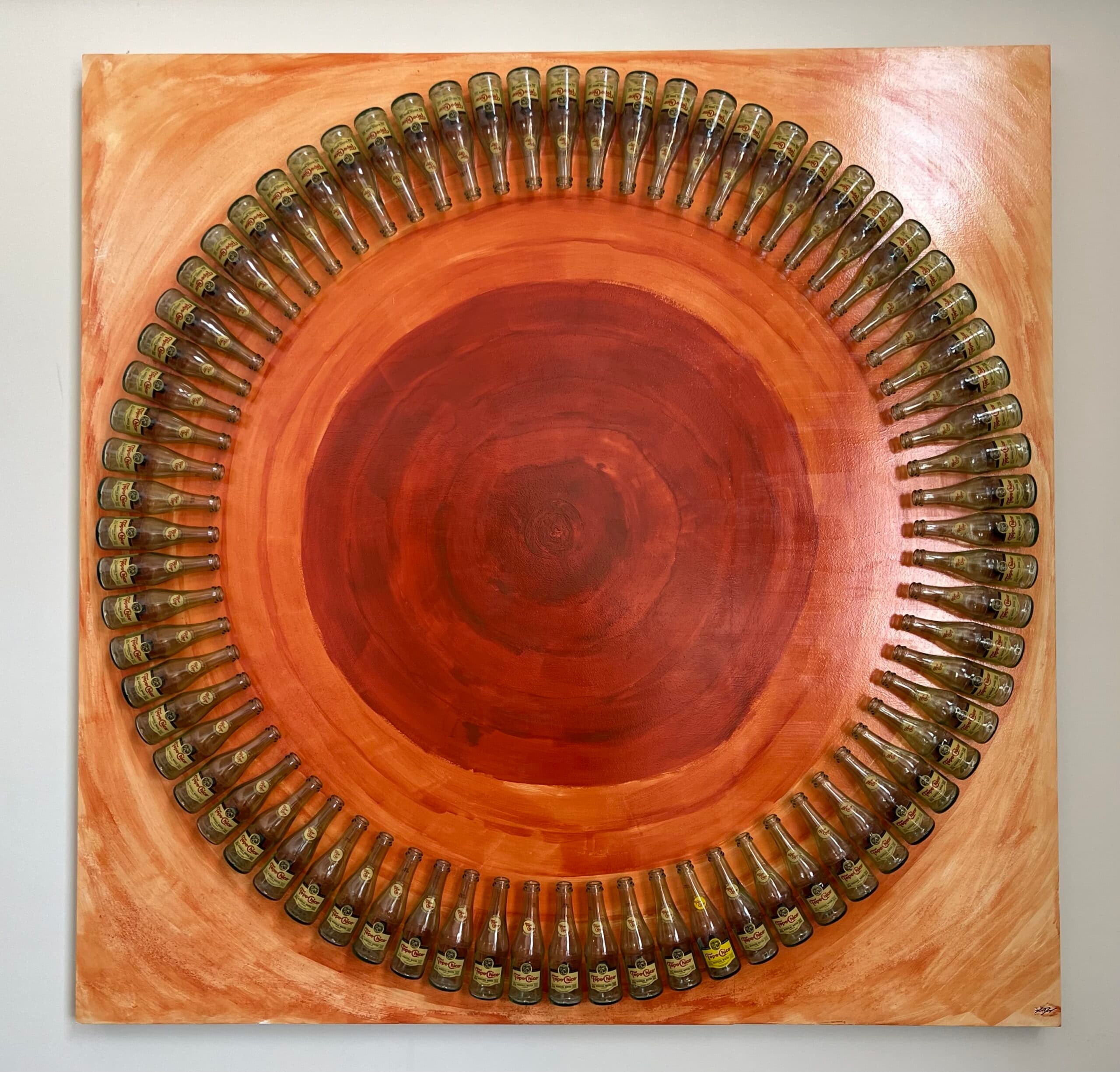 Lente — 72 Topo Chico bottles arranged in a circular pattern